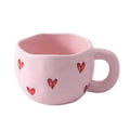 Ceramic cup with red heart and handle